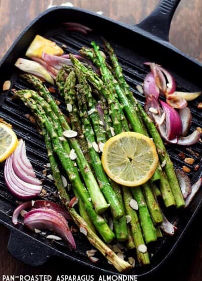 Pan Roasted Asparagus Almondine - Asparagus spears sauteed with almonds, red onions and lemon slices.