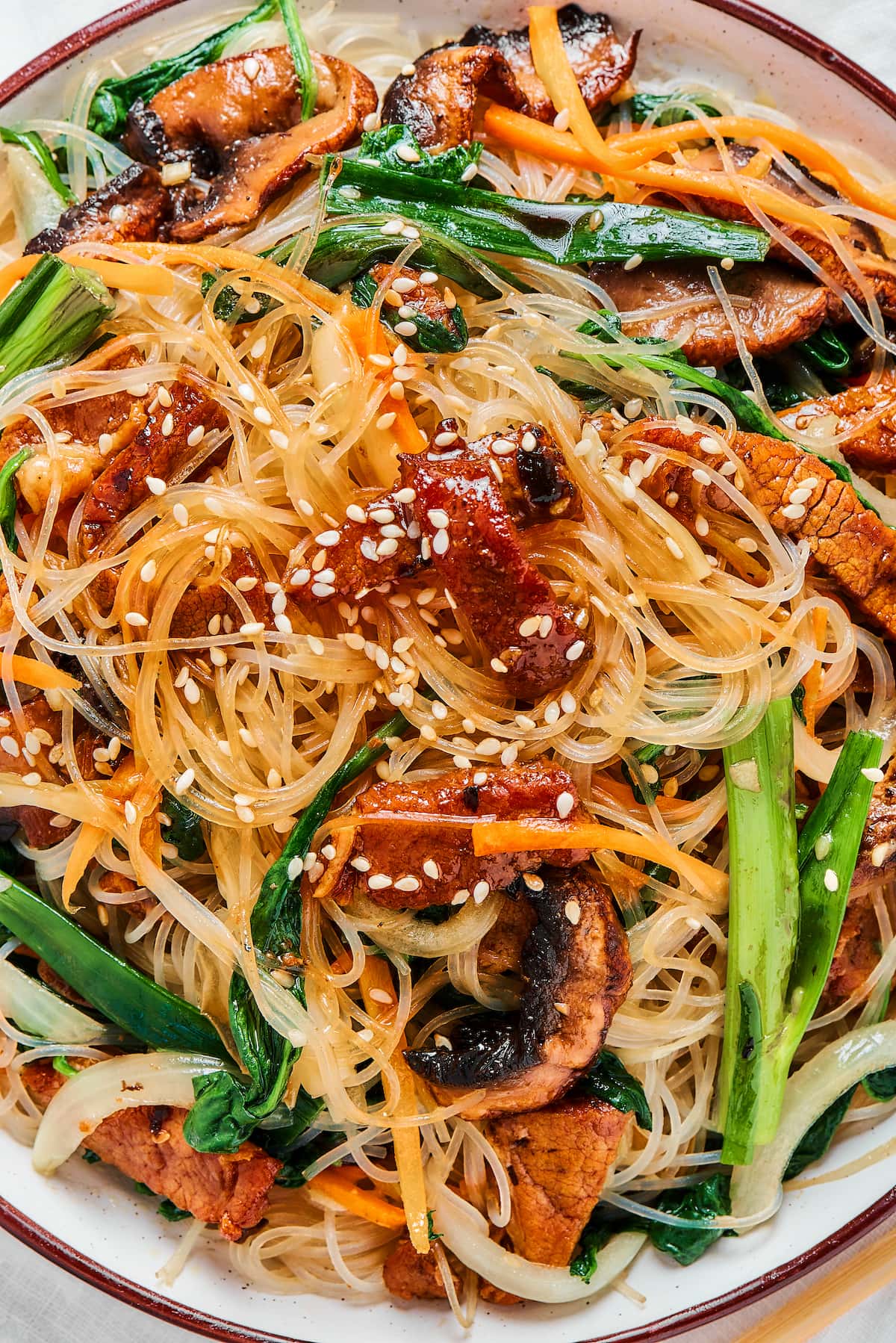 Close-up shot of beef stir fry with glass noodles.