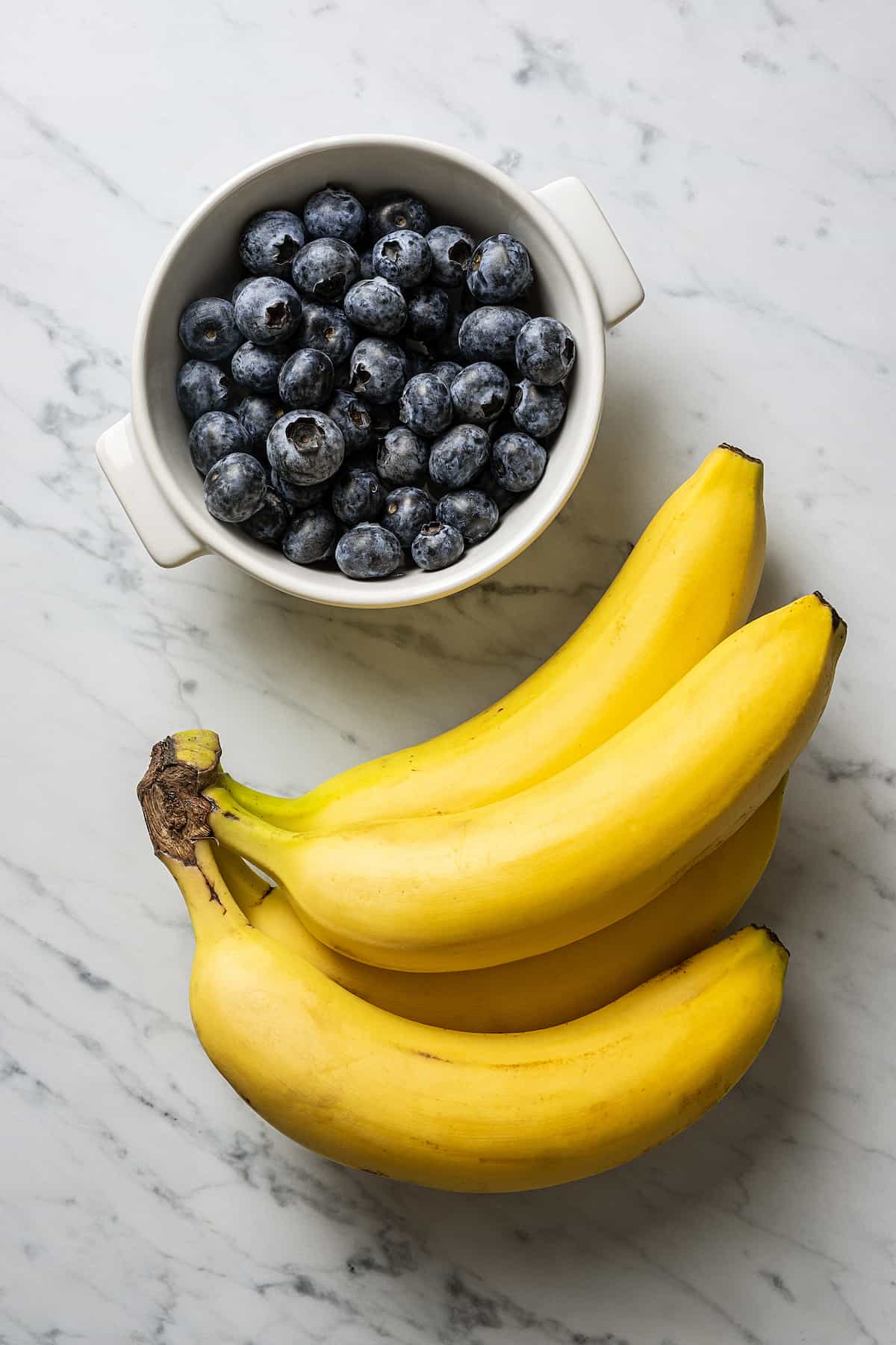 The ingredients for vegan blueberry ice cream: blueberries and bananas.