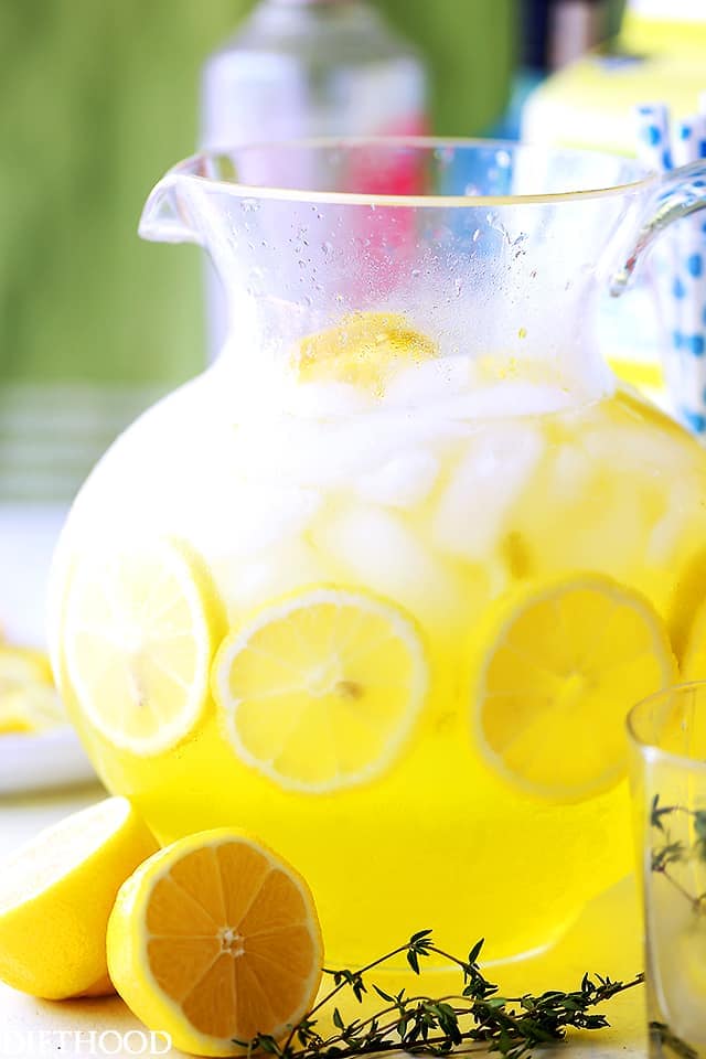 Happy Hour Lemonade IN a glass pitcher.