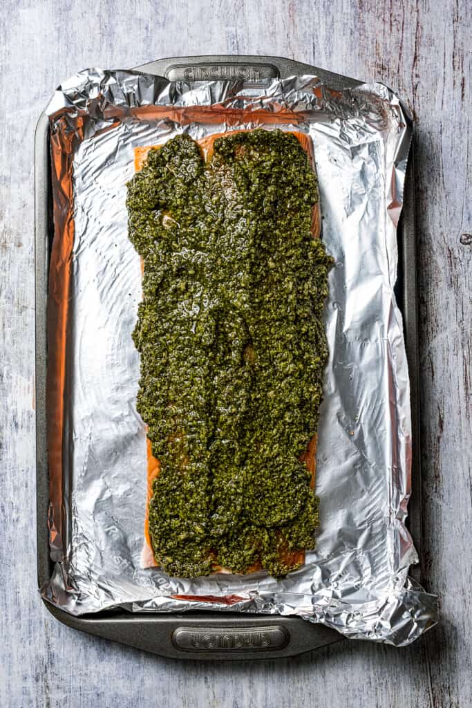 A pesto-covered salmon fillet.