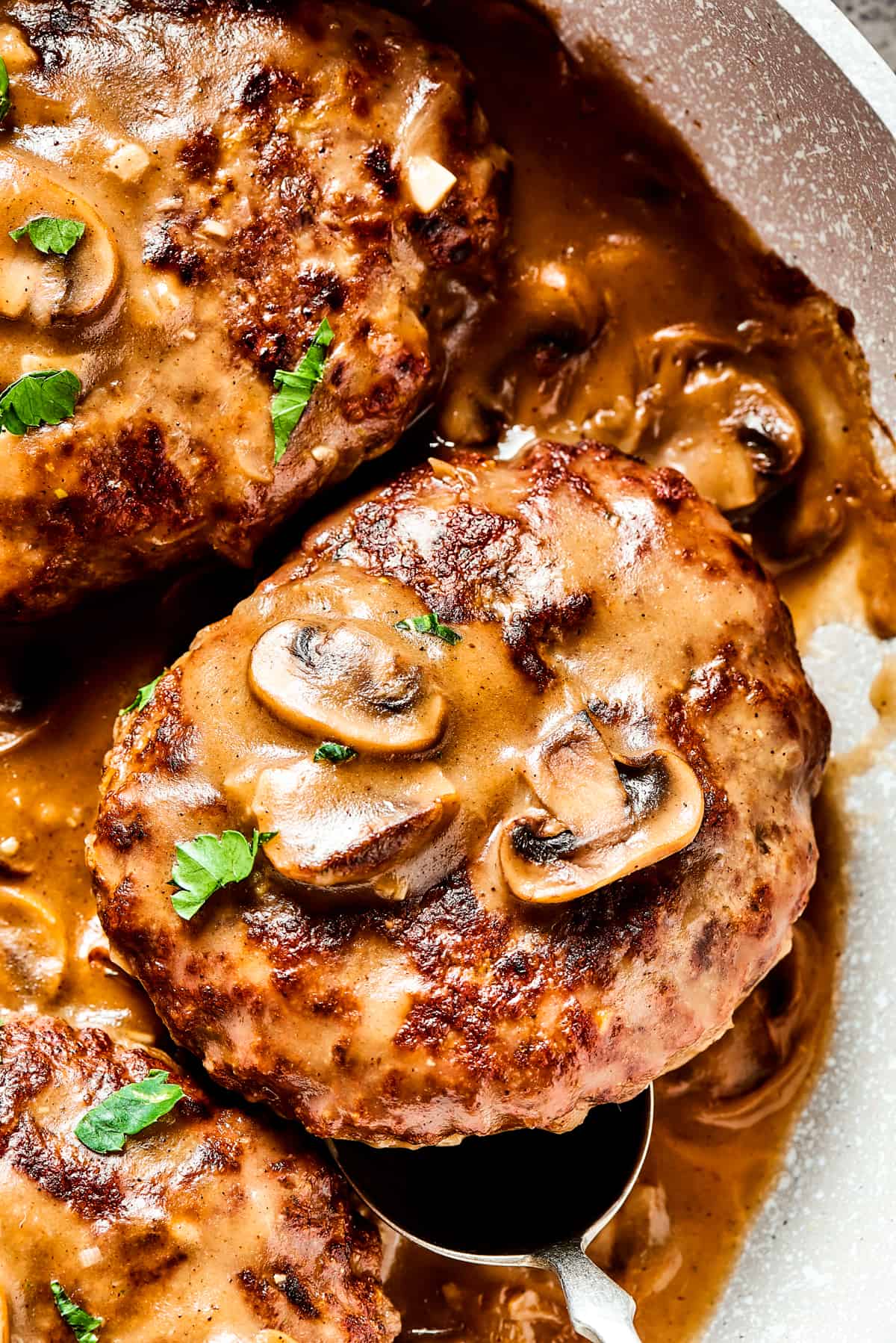 Close-up shot of Salisbury Steak with Mushroom Gravy.