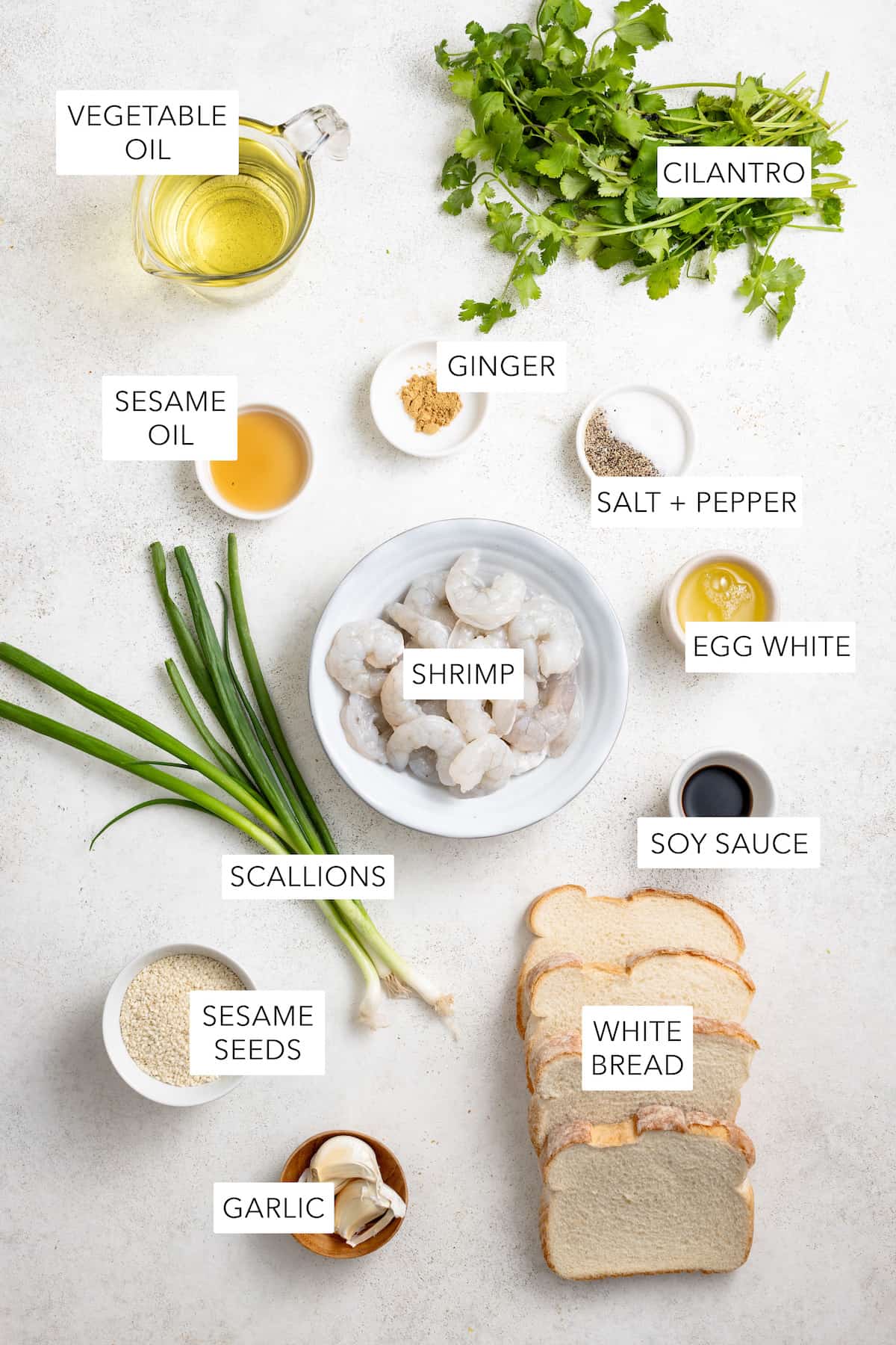 Ingredients for shrimp toast separated into bowls.