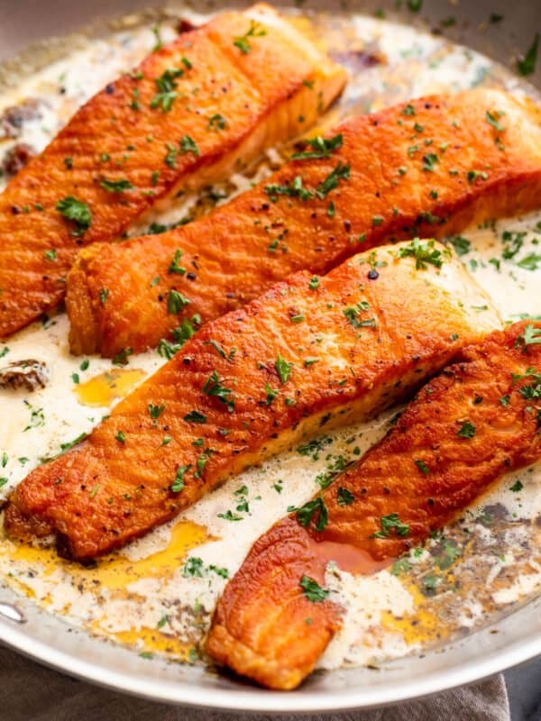 cooking four salmon fillets in cream sauce
