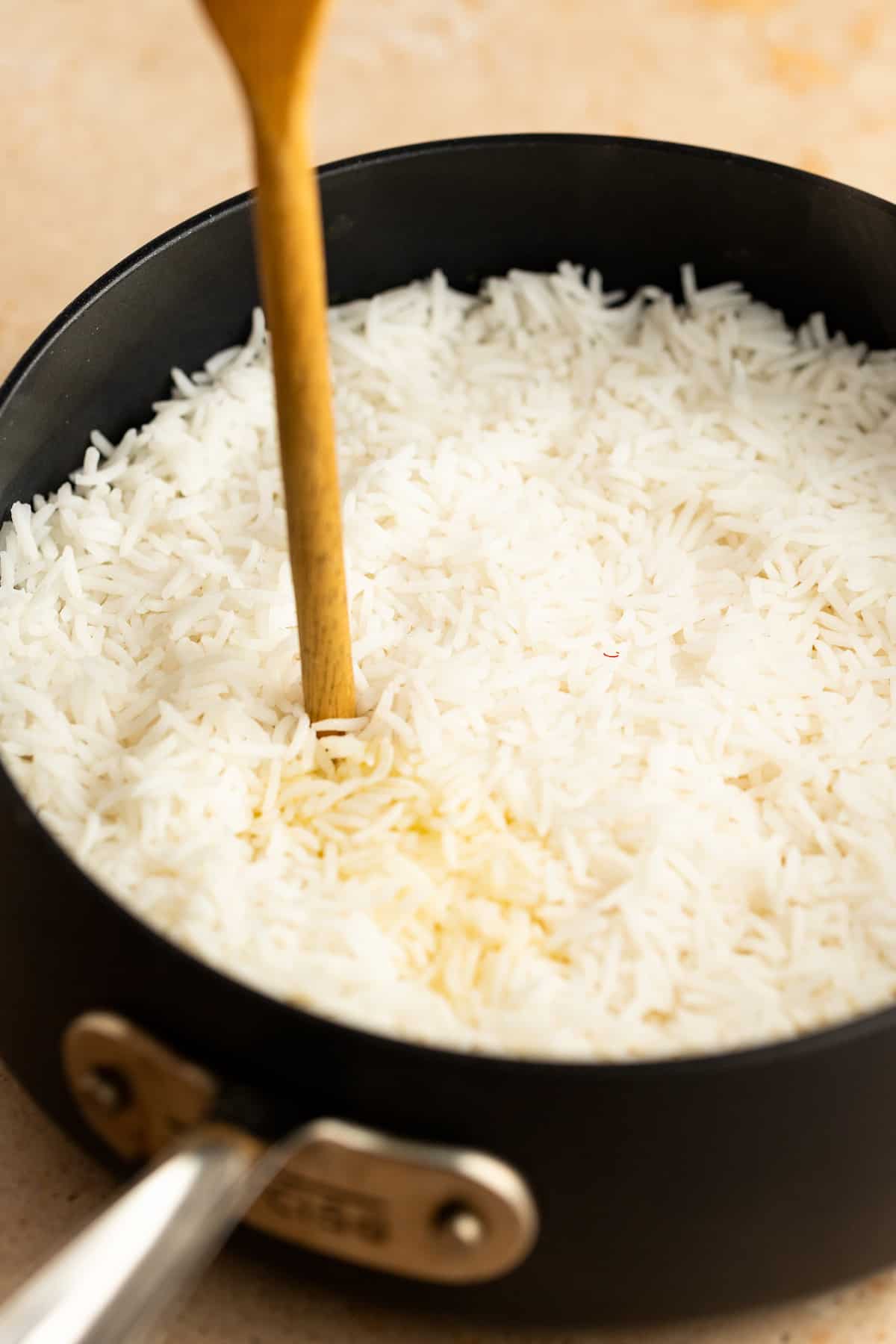 Poking holes in the rice.